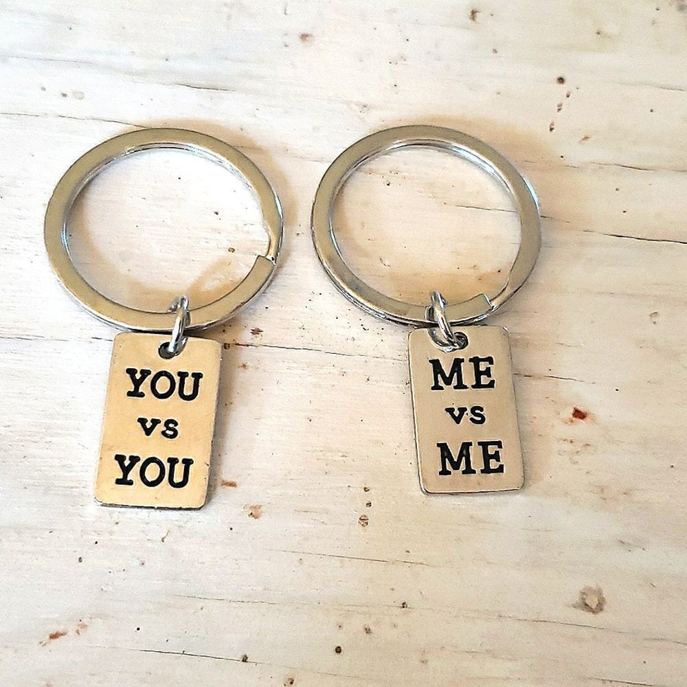 Key rings, his and hers, silvertone